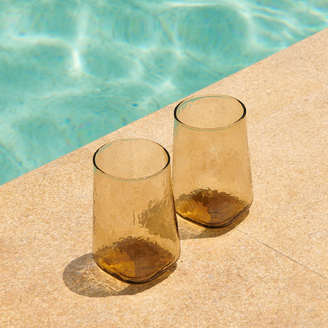 2 tall brown drinking glasses with hammered effect